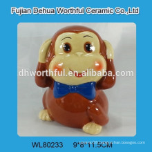 Painted ceramic monkey money bank